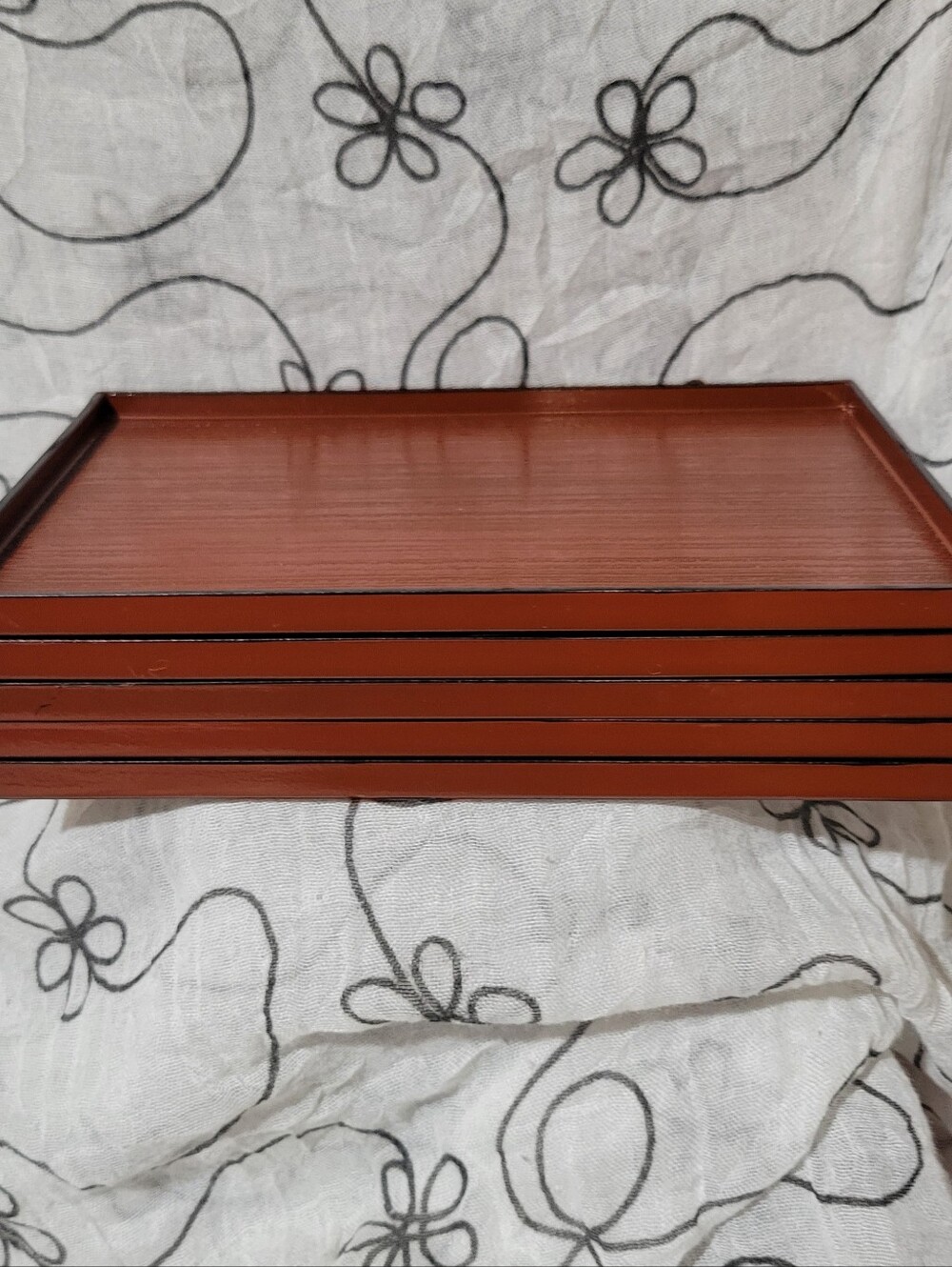 Stack of 5 reddish-brown traditional Japanese lacquer trays